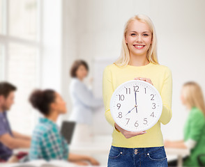 Image showing student with wall clock