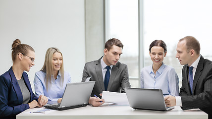 Image showing business team with laptop having discussion