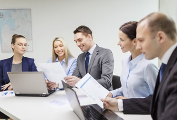 Image showing business team with laptop having discussion