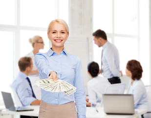 Image showing young businesswoman with dollar cash money