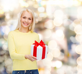 Image showing smiling girl with gift box