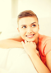 Image showing smiling woman lying on the couch