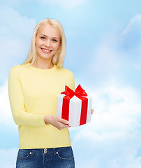 Image showing smiling girl with gift box