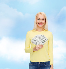 Image showing smiling girl with dollar cash money