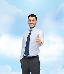 Image showing handsome businessman showing thumbs up