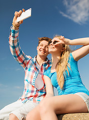 Image showing smiling couple having fun outdoors