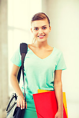 Image showing student girl with school bag and color folders