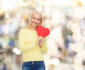 Image showing smiling woman with red heart