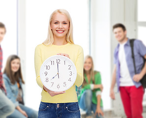 Image showing student with wall clock