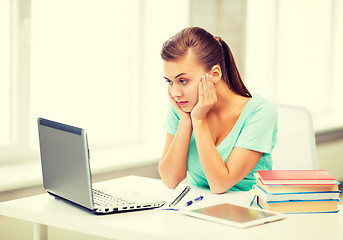 Image showing stressed student with computer at home