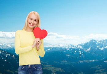 Image showing smiling woman with red heart