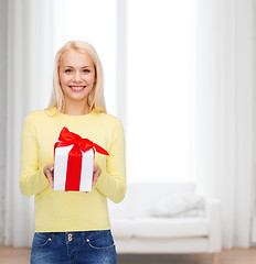 Image showing smiling girl with gift box