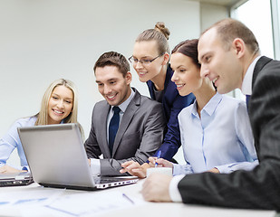 Image showing business team with laptop having discussion