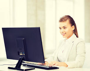 Image showing businesswoman with computer in office