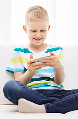 Image showing smiling little boy with smartphone