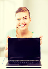 Image showing smiling student girl with laptop
