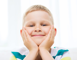 Image showing smiling little student boy at home