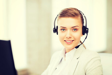 Image showing female helpline operator with headphones