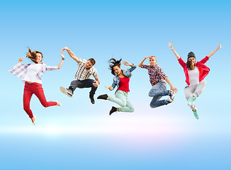 Image showing group of teenagers jumping