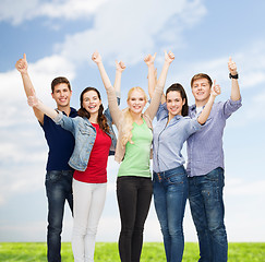 Image showing group of smiling students showing thumbs up