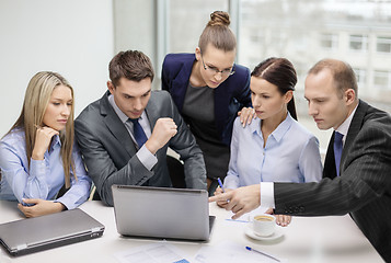 Image showing business team with laptop having discussion