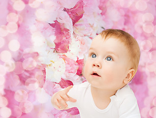 Image showing curious baby looking up