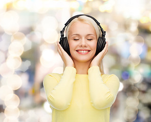 Image showing smiling young woman with headphones