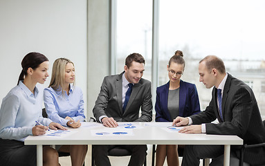 Image showing business team with documents having discussion