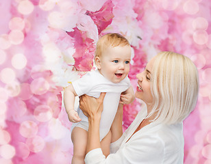 Image showing happy mother with smiling baby