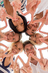 Image showing smiling friends in circle