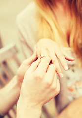 Image showing romantic man proposing to beautiful woman