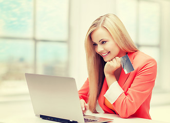 Image showing happy teenage girl with laptop and credit card