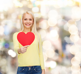 Image showing smiling woman with red heart