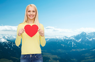 Image showing smiling woman with red heart