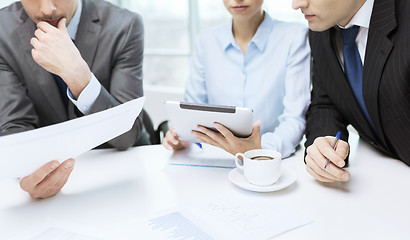 Image showing business team with graph, tablet pc and coffee