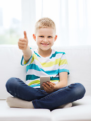 Image showing smiling boy with smartphone showing thumbs up