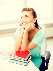 Image showing happy smiling student girl with books