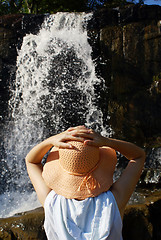 Image showing Woman near waterfall