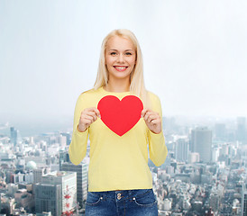 Image showing smiling woman with red heart