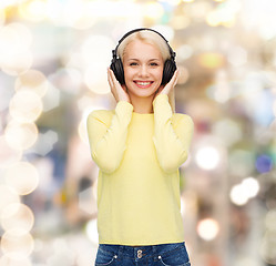 Image showing smiling young woman with headphones