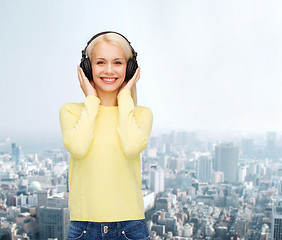 Image showing smiling young woman with headphones