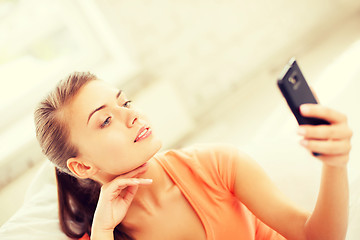 Image showing woman making self portrait with smartphone