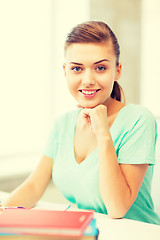 Image showing happy smiling student girl with books