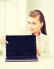 Image showing businesswoman with laptop in office