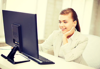 Image showing businesswoman with computer in office