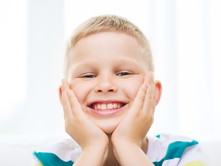 Image showing smiling little student boy at home