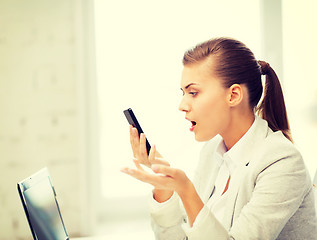 Image showing woman shouting into smartphone