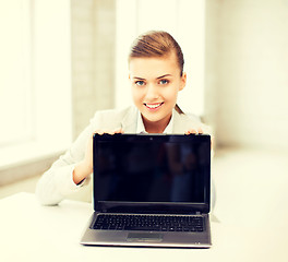 Image showing businesswoman with laptop in office