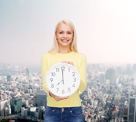 Image showing student with wall clock