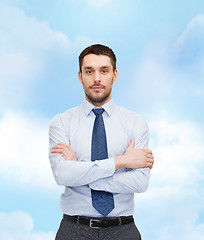 Image showing handsome businessman with crossed arms